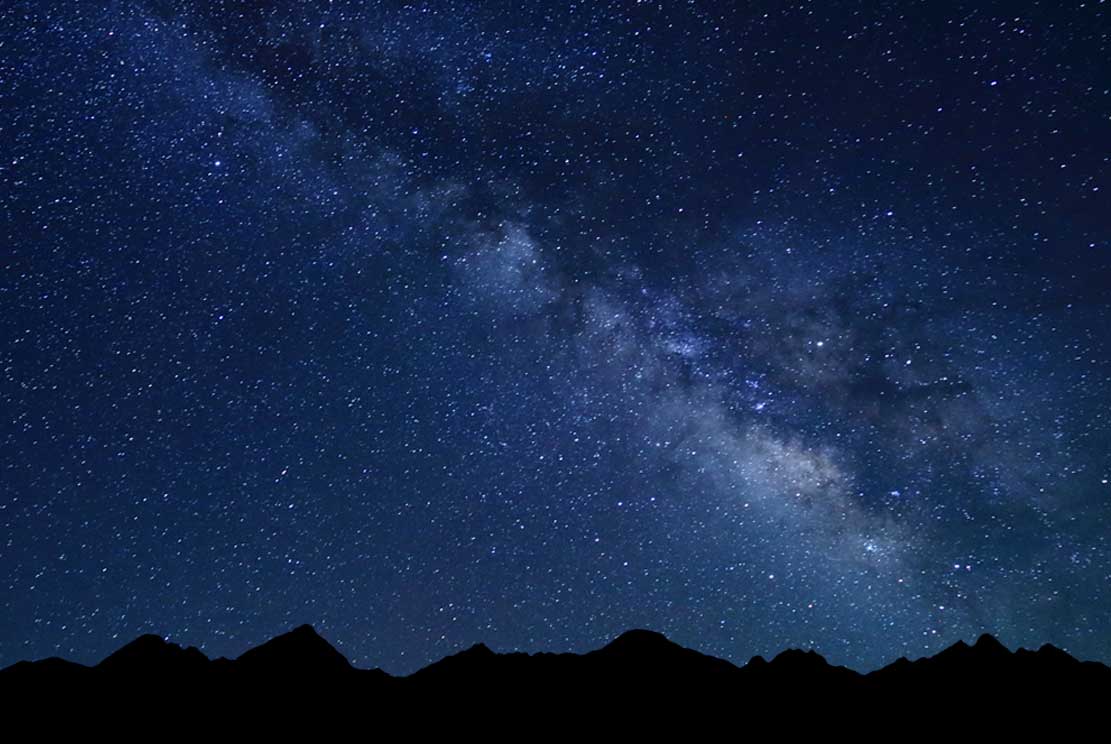 starry night with Milky way and silhouette of High Tatras mountains 