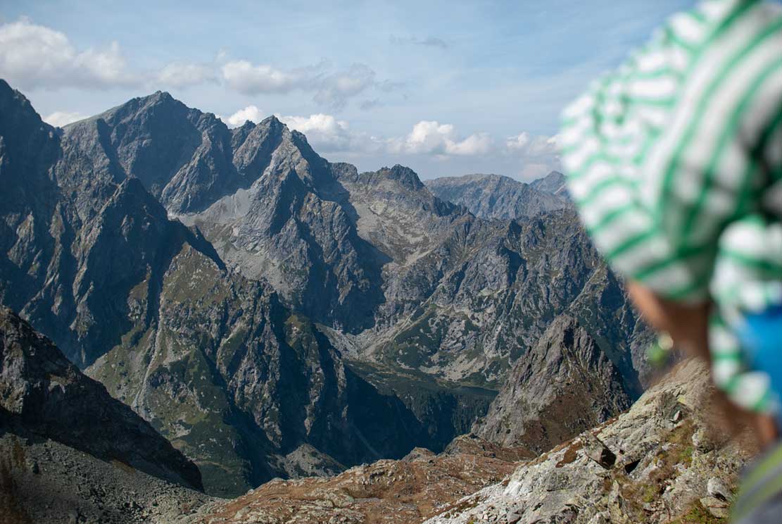 a person overlooking beautiful mountains from 2290 meters above the sea level