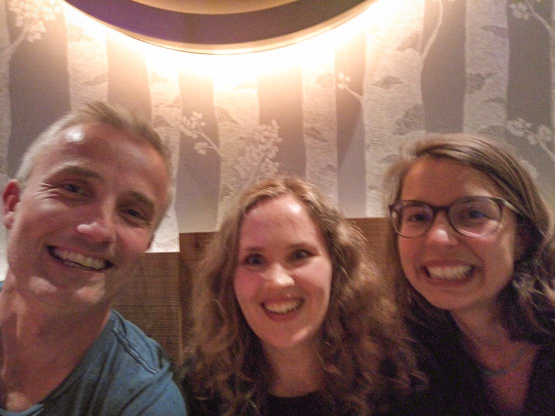 Jozef, Marit and Meline smiling after a vegan burger (delicious!) in a restaurant in Nuremberg 