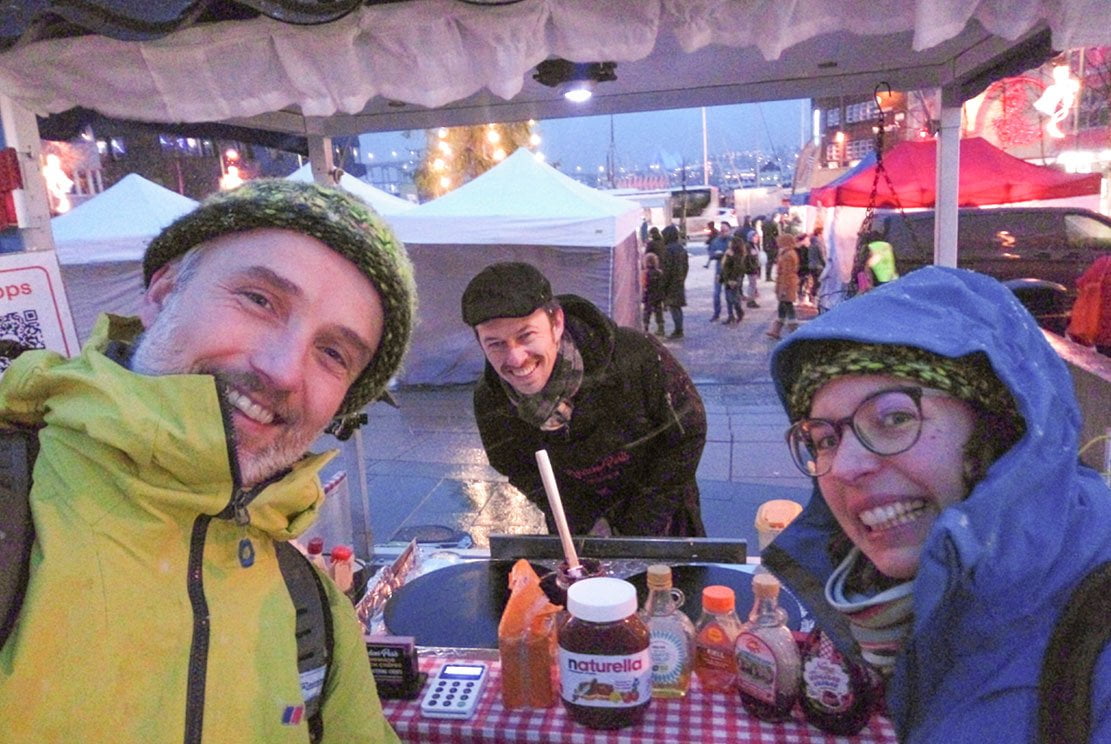 3 people around a crêperie stall in Tromsø